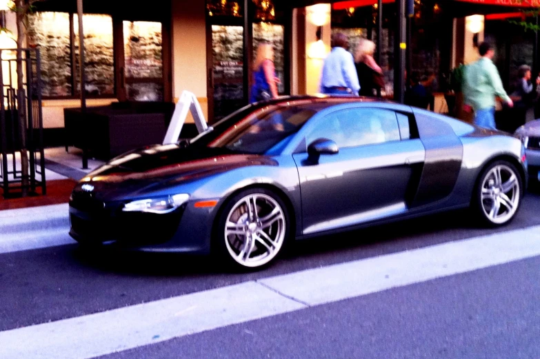 this is a sleek car parked at the curb