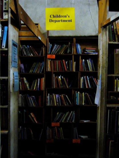 several books are stacked up on a book shelf