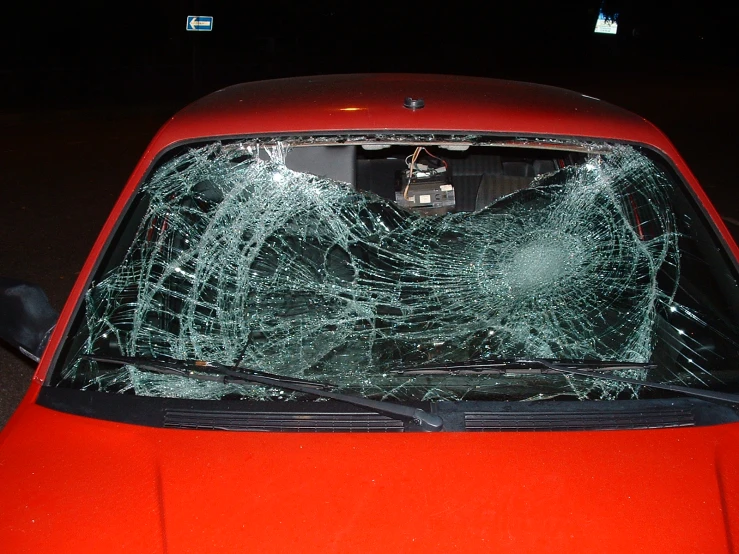 an image of a broken windshield in the middle of the street