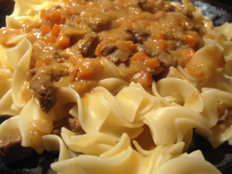 closeup of noodles and other ingredients on a plate