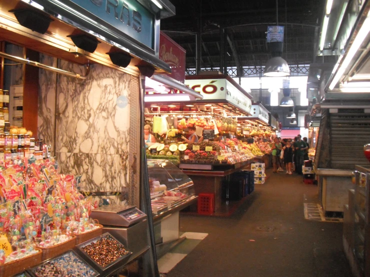 many people and shops filled with colorful goods