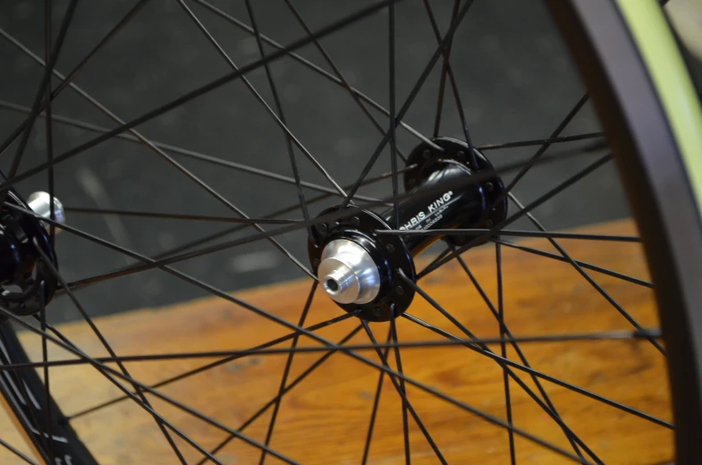 a close up of two bike wheels with spokes