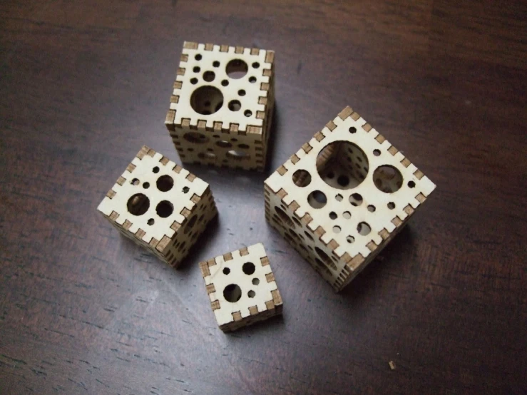 three white and brown legos sitting on a table
