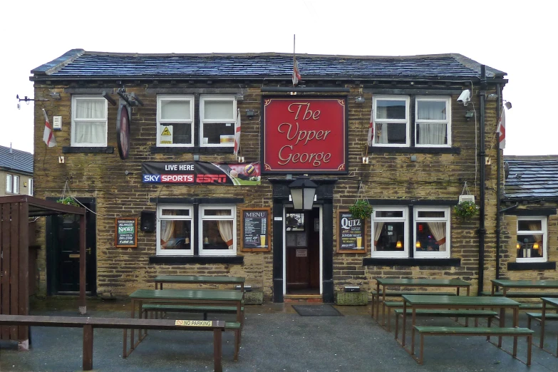 a restaurant with many tables on the front