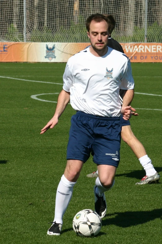 a soccer player in action on the grass