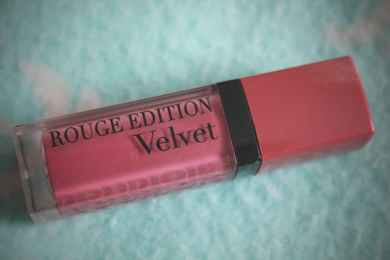a lipstick that is on a surface