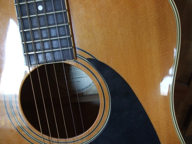 a guitar is pographed with the top partially open