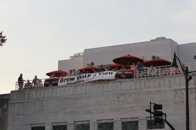 a long banner on the side of a building advertising brew week