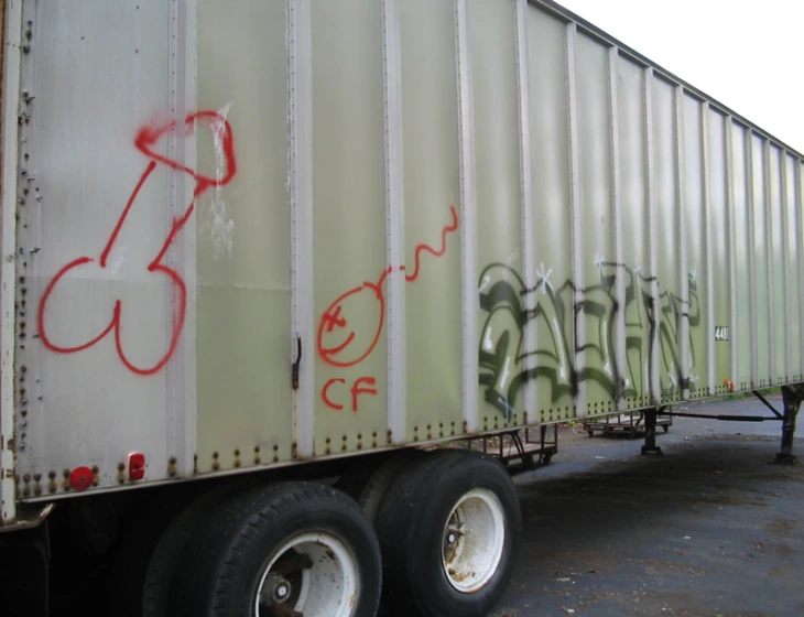 a truck that has a lot of grafitti on it