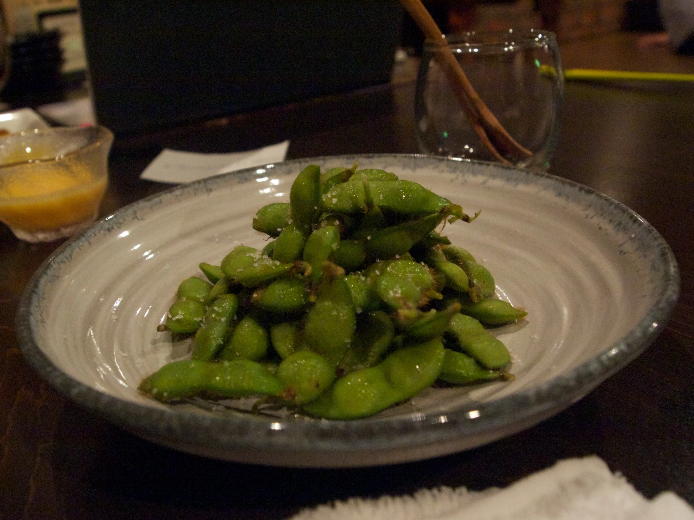 a plate of green peppers on a table