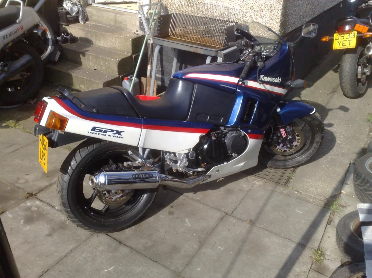 a vintage motorcycle that is parked on the side of the road