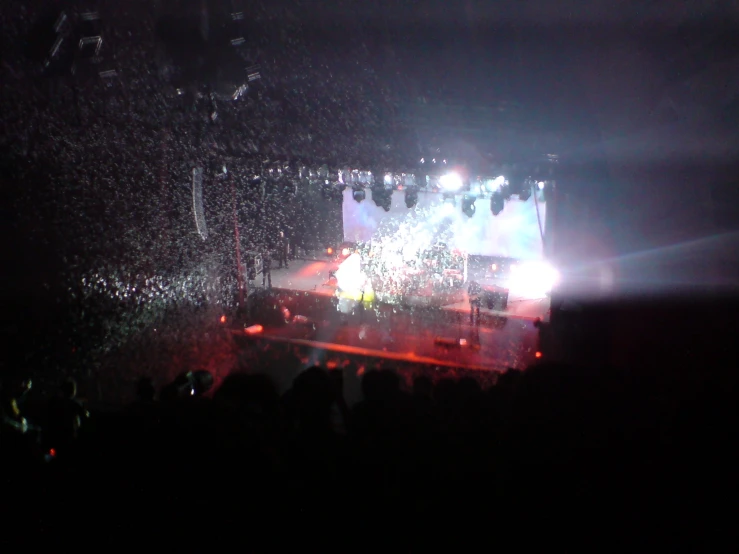 a band is performing on the stage, while people look on