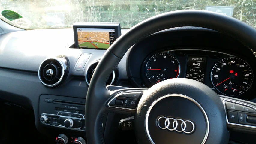 an inside view of a car with its dashboard monitor turned