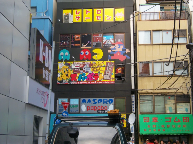 an advertit on a building is painted black