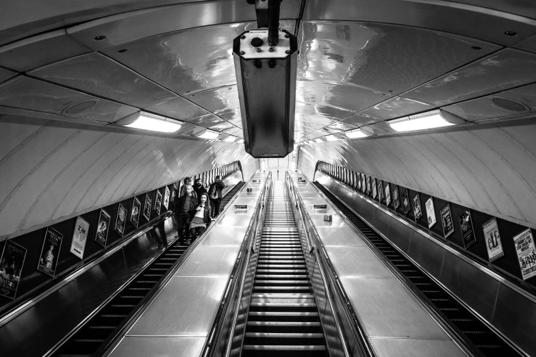 two escalators in a train or subway area