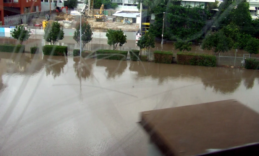 a large area of brown water and houses