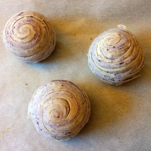 three round cakes that are on top of a counter