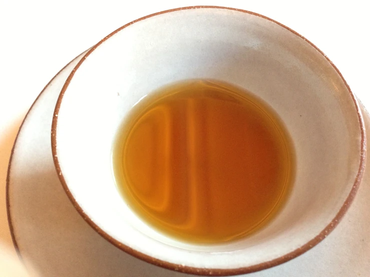 a bowl full of tea is shown from above