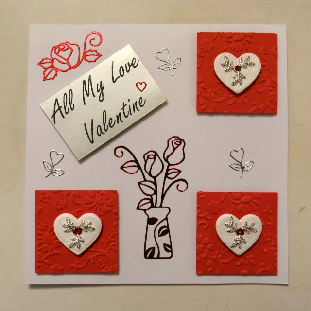 a valentine's day greeting with paper hearts and flowers