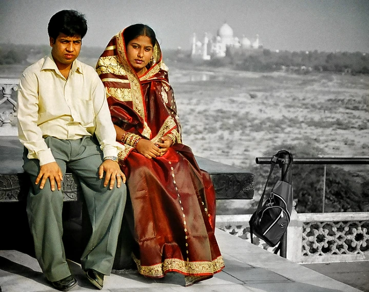 a man and a woman sitting next to each other