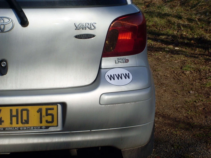 a silver car parked on the side of a road