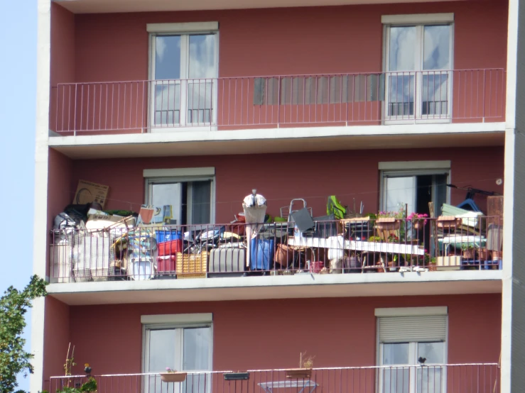 there are several balconies on the balcony of this apartment building