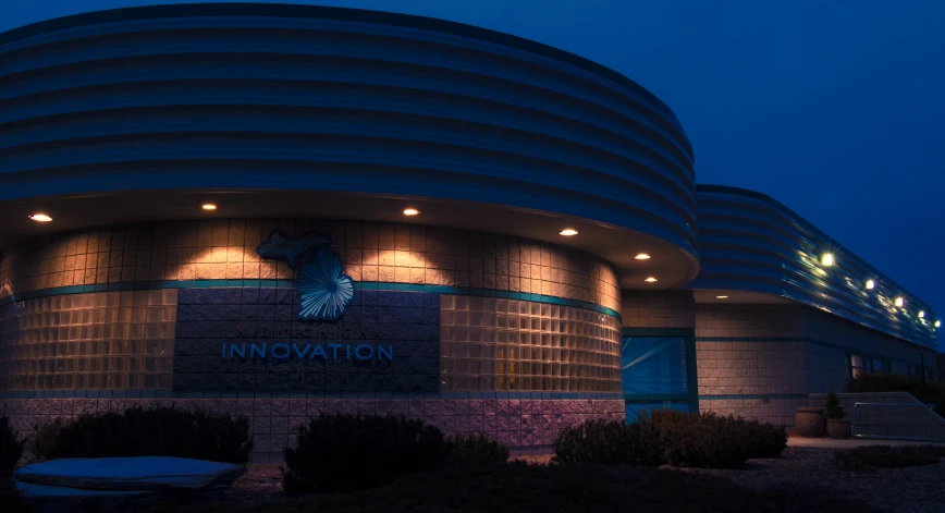 the entrance to an innovation center with lights on