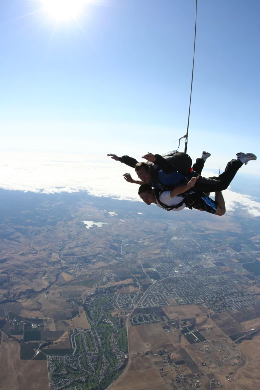 a man is paragliding high over the earth