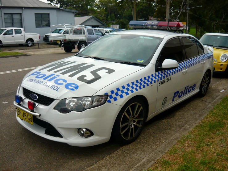 a police car is parked on the side of a road