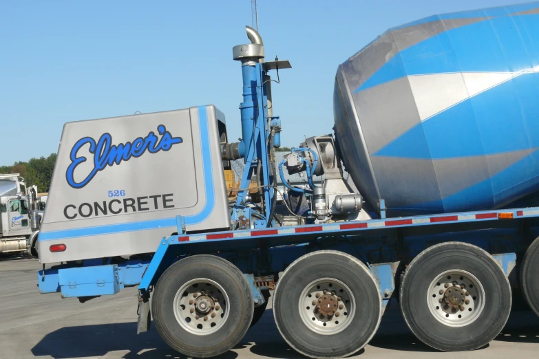 the large truck is parked outside with its crane arm extended