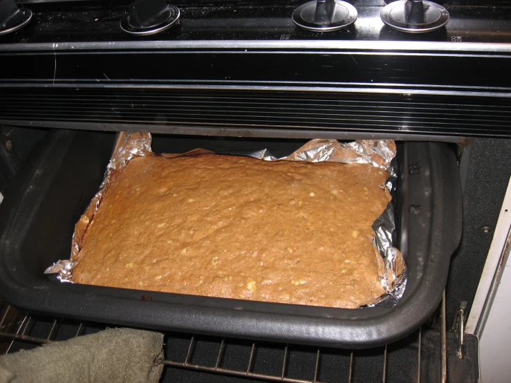 a square cake is sitting in the oven