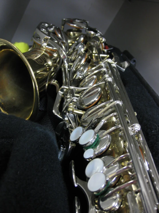 a large metal saxophone sitting on a chair