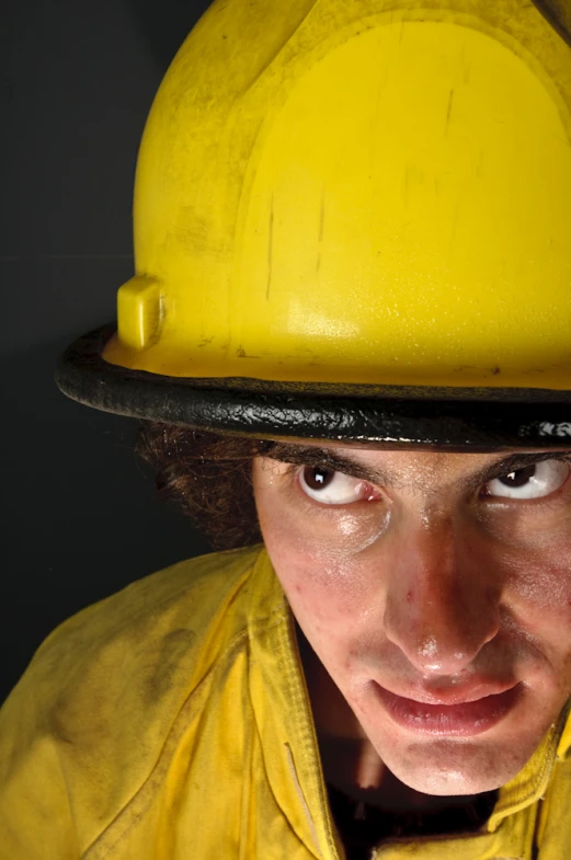 a close up of a person wearing a firefighter's uniform