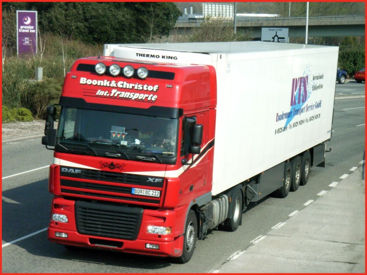 the truck is carrying the container on the road