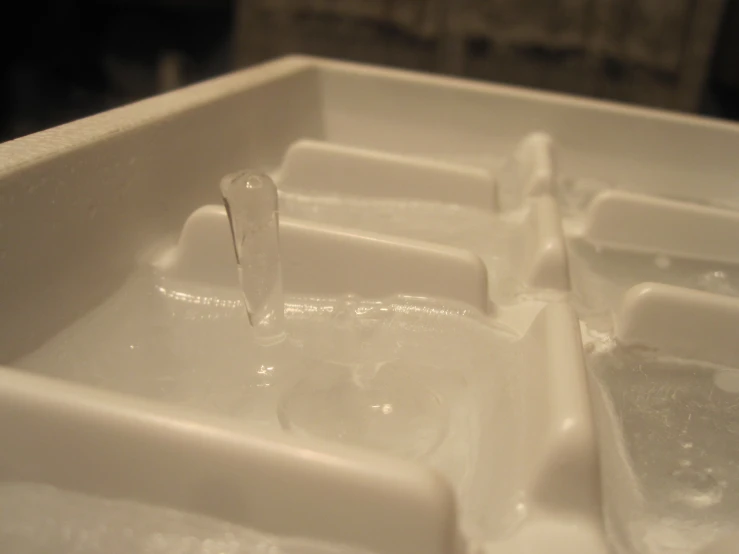 water flowing from a faucet on a sink