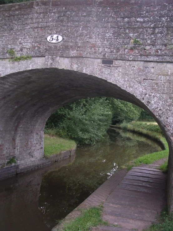 bridge over water near entrance to roadway near roadway