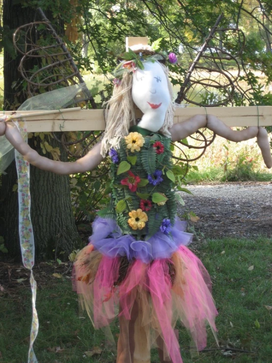 there is a mannequin holding a bunch of flowers in her hands