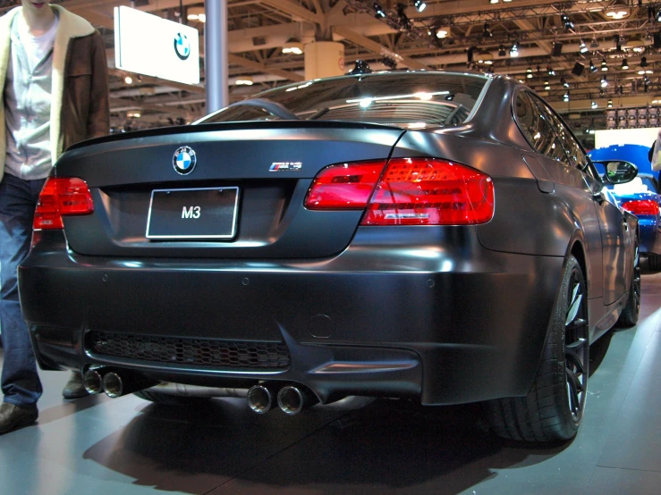 a bmw car that is parked on a show floor