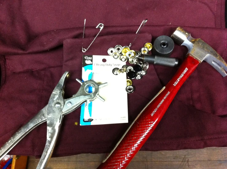 various tools are laid out on the floor with a piece of paper