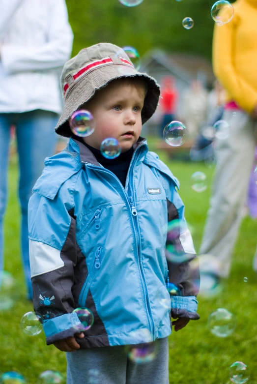 a  standing next to bubbles in the air