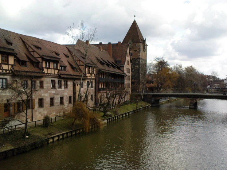 many old buildings next to the water