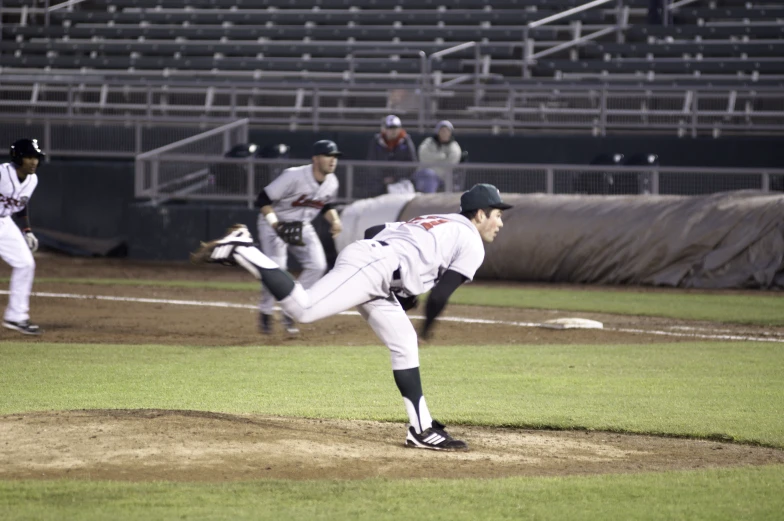 the pitcher has just thrown a pitch to a batter