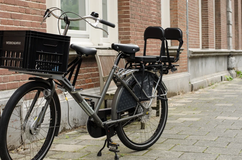 a bicycle that is parked next to a brick building