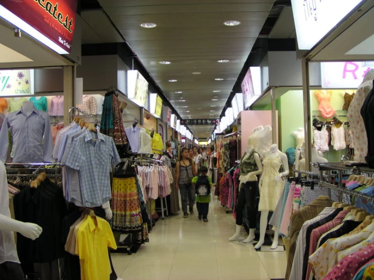 a retail store with lots of clothing on display