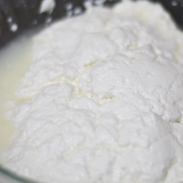 flour is put in a bowl that is full of milk