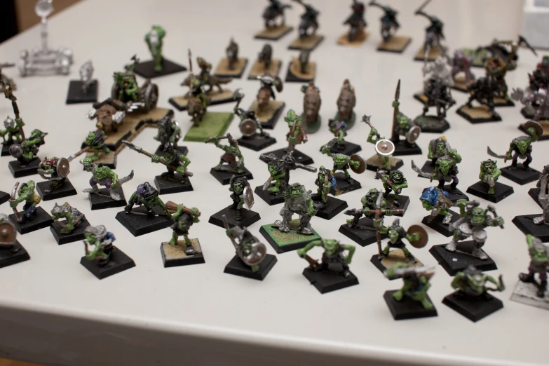 large group of warhammers on white table
