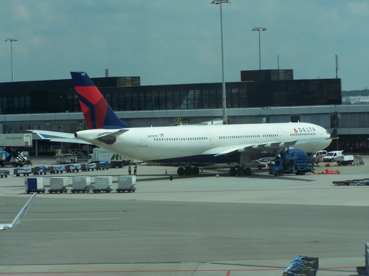 a plane sits on a run way at an airport