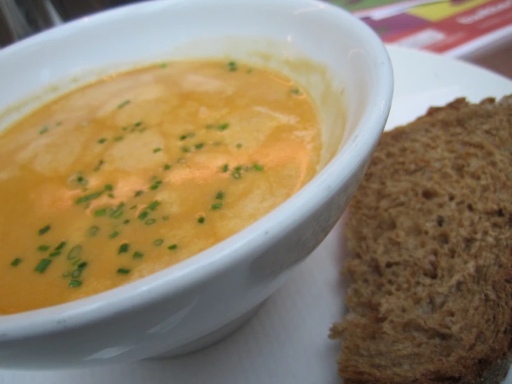 a meal is pictured here with soup and bread