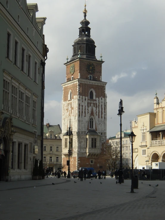 a clock tower that is in the middle of the city