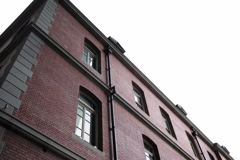 an old brick building with many windows and light